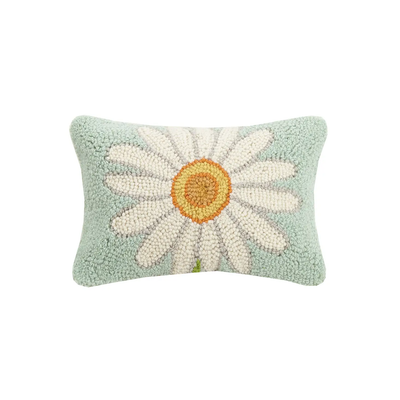Hooked Pillow with daisy on pastel blue background
